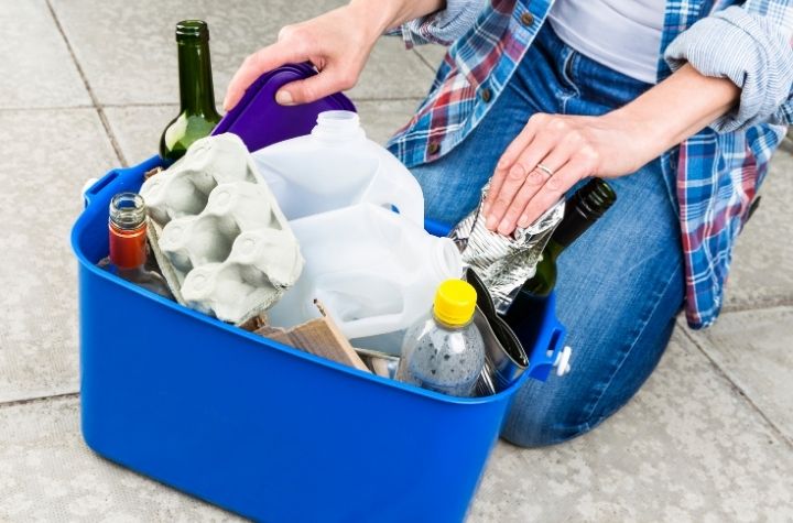 recycling bin with plastic milk jubs