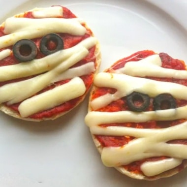 Pizza Mummies made on English Muffins with mozzarella cheese.