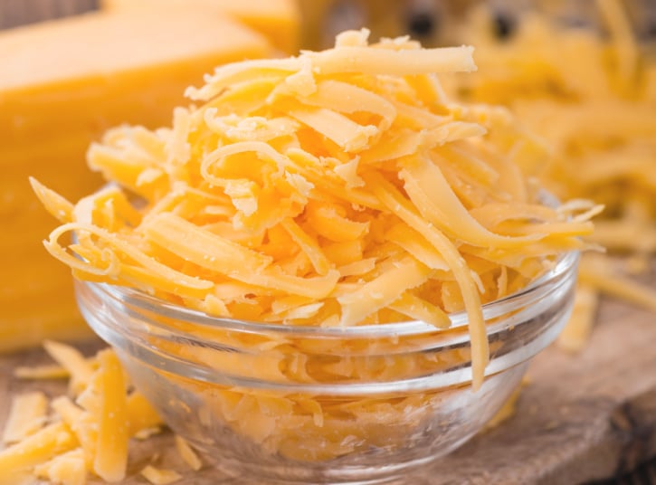 Bowl of grated Cheddar Cheese