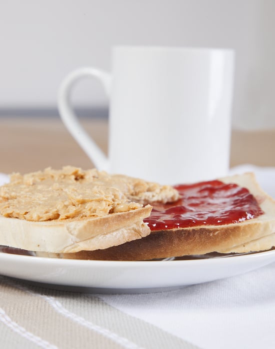 Strawberry Jam and Peanut Butter on Toast with a Cup of Coffee