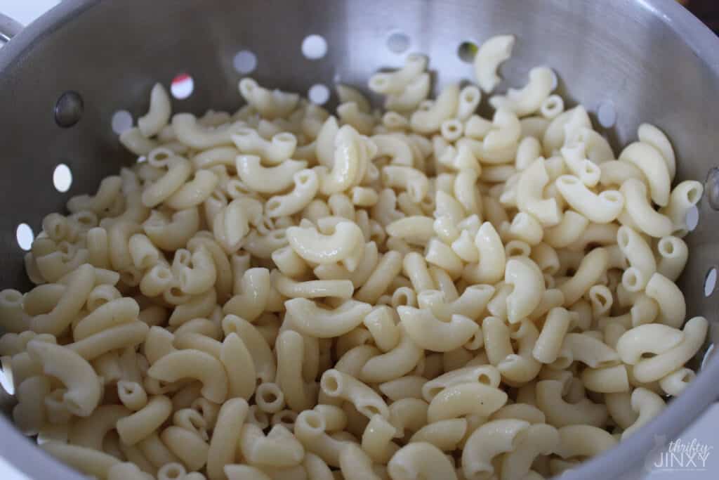 Cooked Macaroni draining in colander