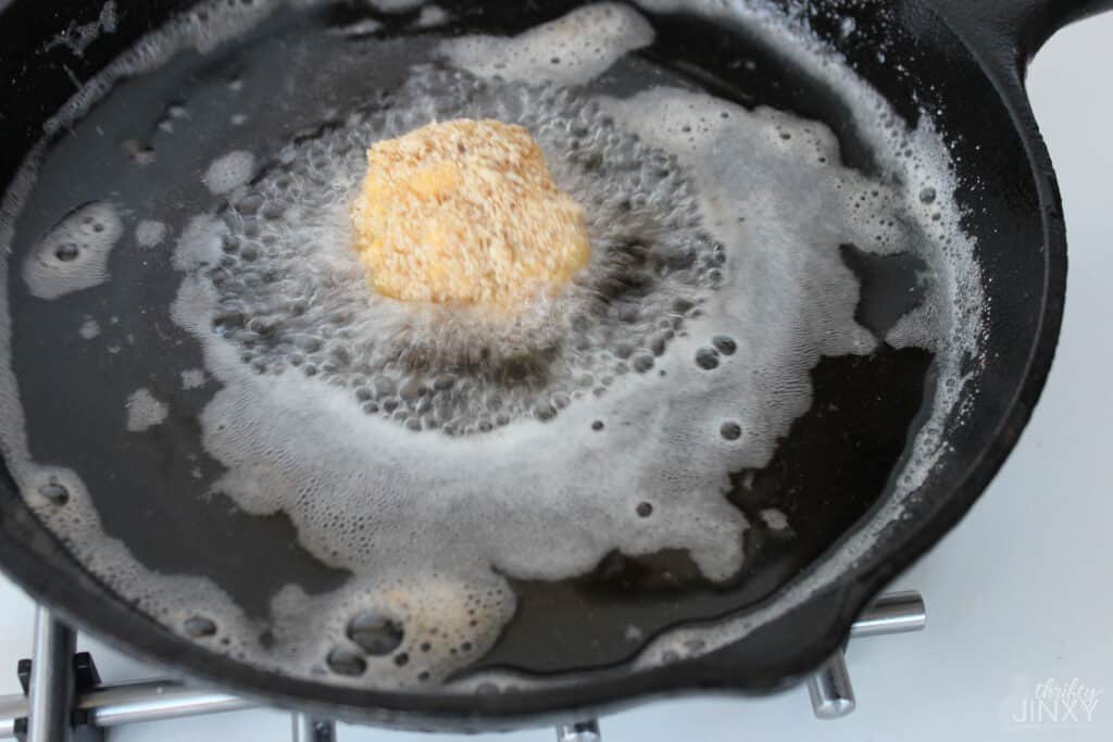 Fried Macaroni and Cheese Bites frying in oil