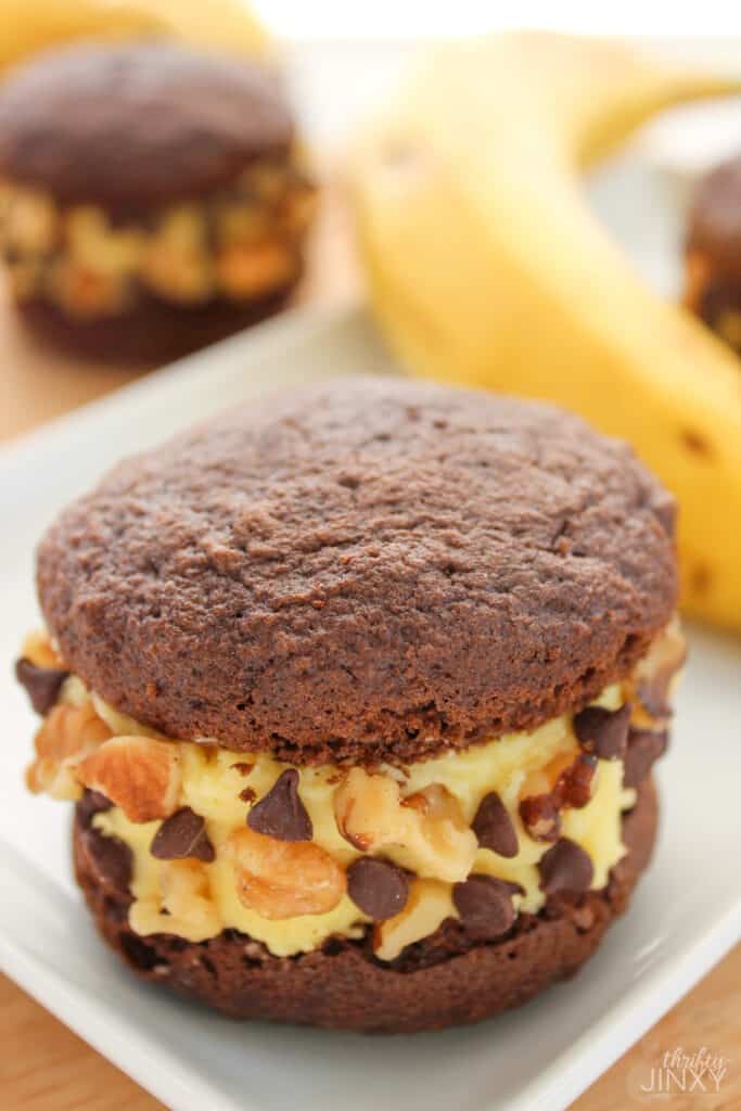 Chunky Monkey Whoopie Pies on Plate with Banana in Background