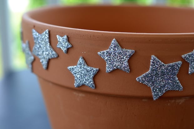 silver metallic stars on a terracotta planter