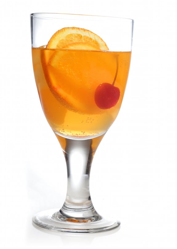non-alcoholic cocktail with orange and cherry