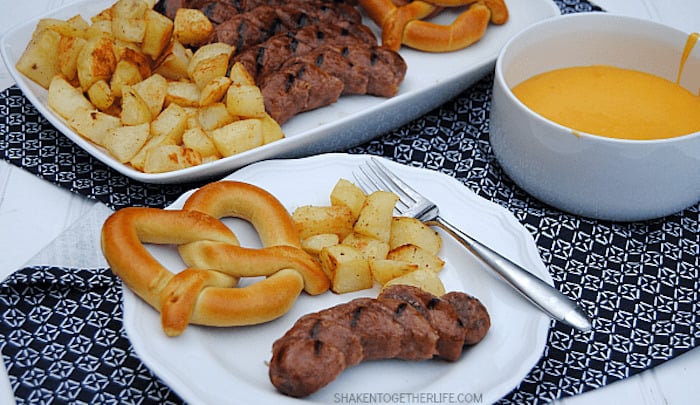 bratwurst dippers and cheese sauce with pretzel