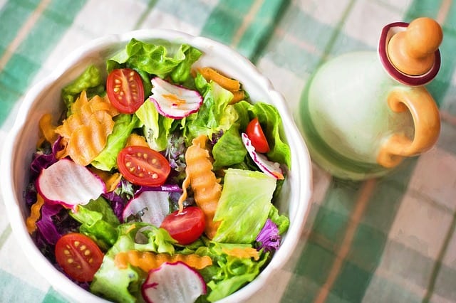 salad with lettuce, raddish, carrot and tomato