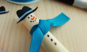 Easy Cheese Stick Snowman with Printable Hats - Thrifty Jinxy