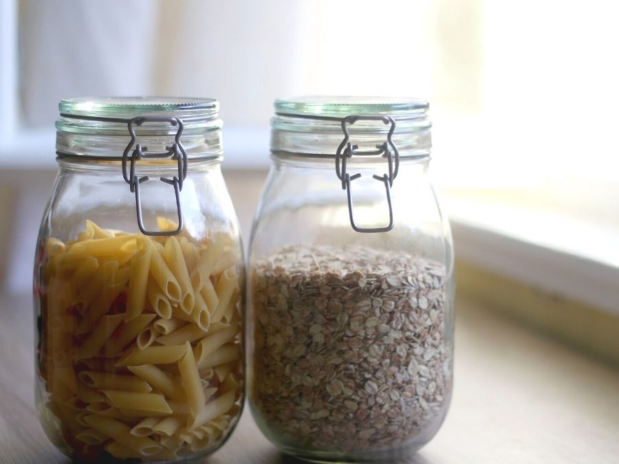 pasta and oatmeal stored in glass jars