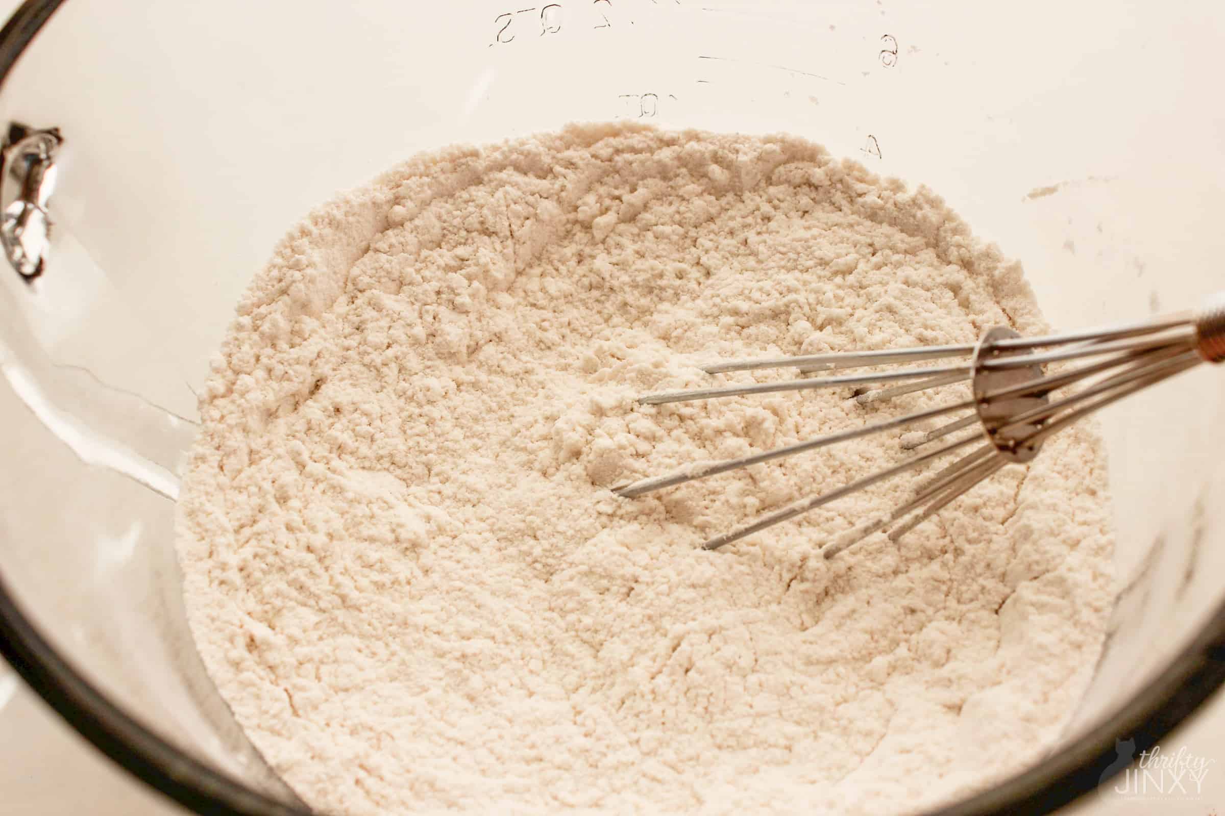 Mixing Homemade Pancake Mix with whisk.