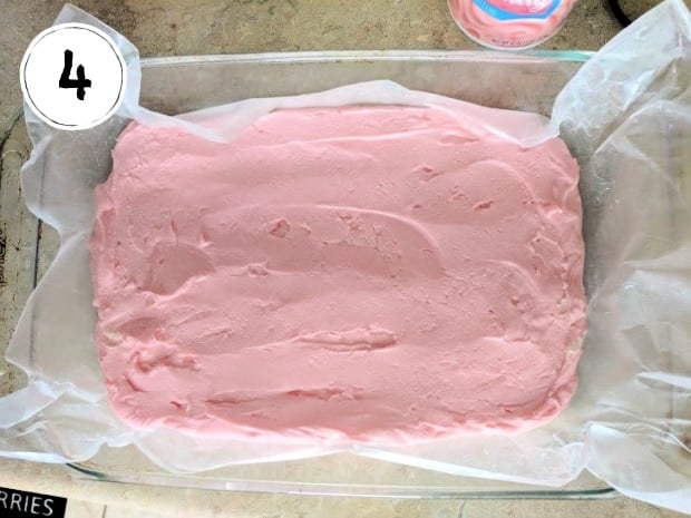 Strawberry Fudge spread in wax paper lined pan.