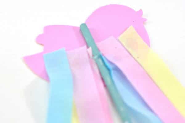 gluing pastel ribbons to Easter wands
