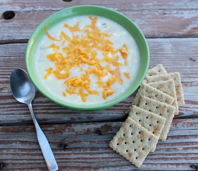 Potato Soup in bowl with saltine crackers on side