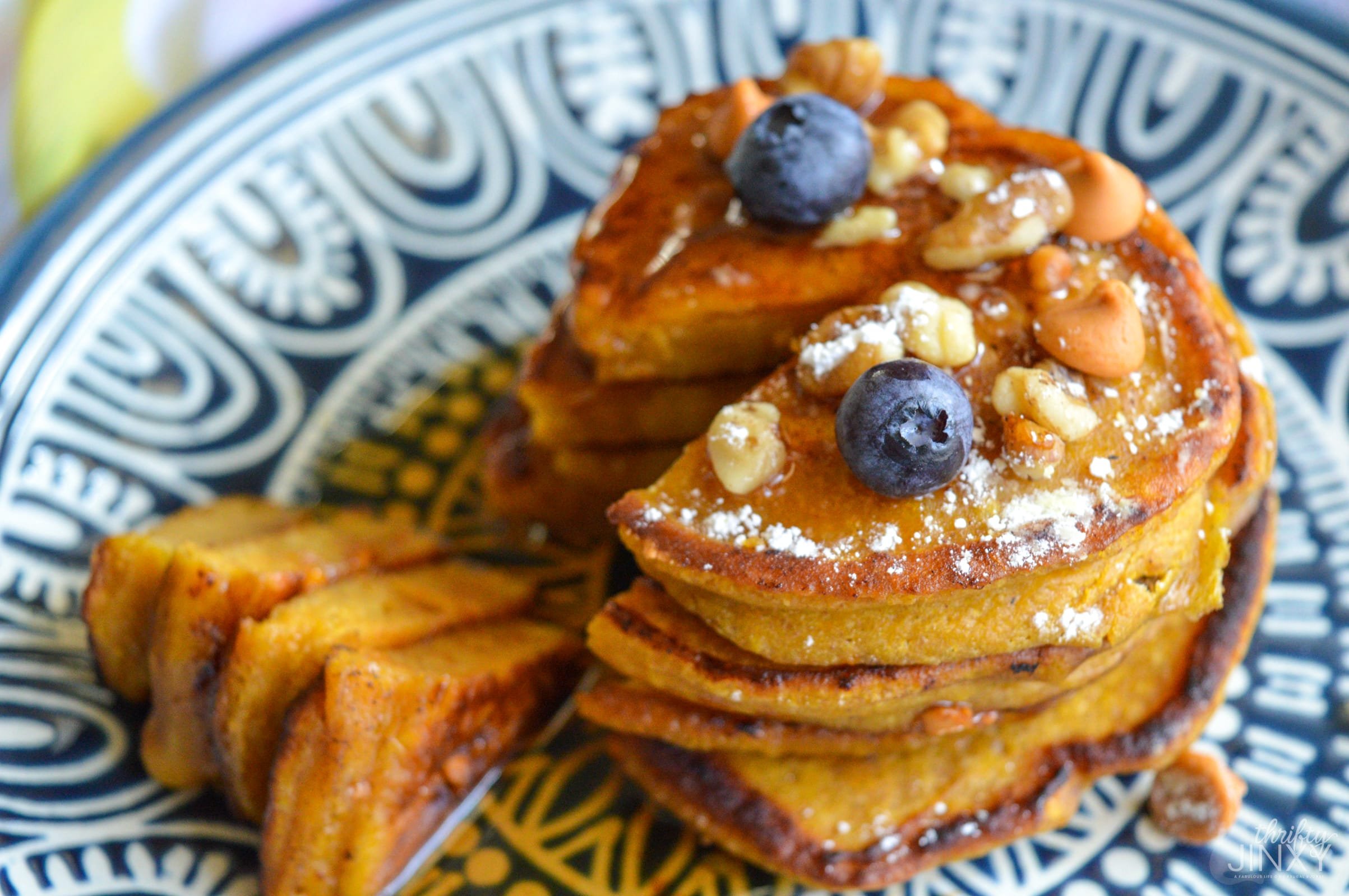 Pumpkin Butterscotch Pancakes on blue and white patterned plate.