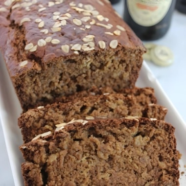 Guinness Bread loaf with several slices cut on end.