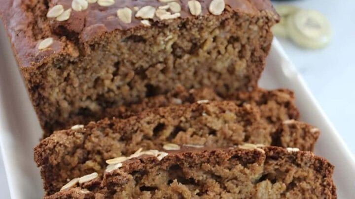 Guinness Bread loaf with several slices cut on end.