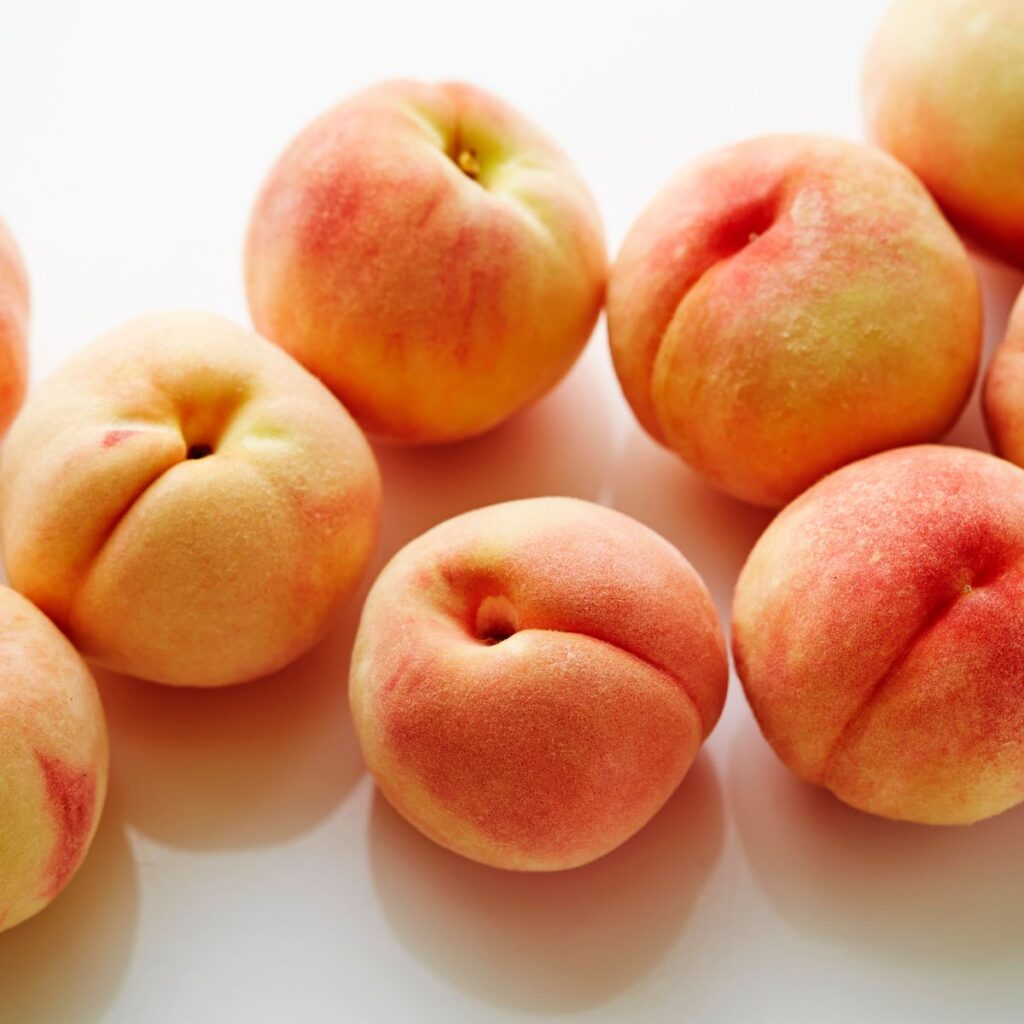 Peaches on White Table