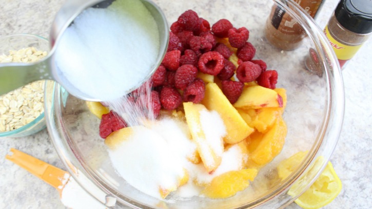 Peaches and Raspberries in Bowl with White Sugar