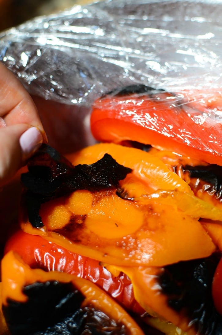 removing charred portions from Oven-Roasted Sweet Peppers