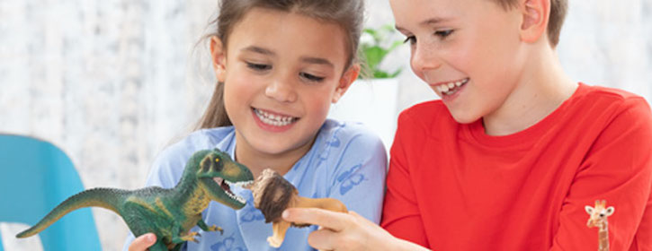 Children Playing with Schleich Dinosaur and Lion