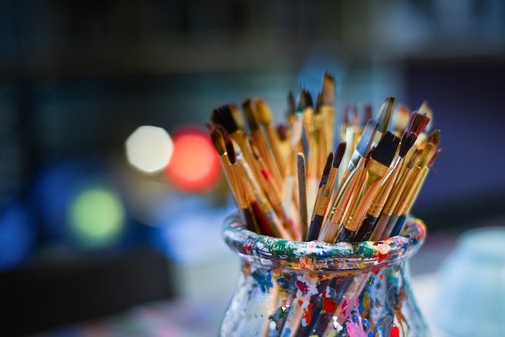 Paint Brushes in Jar Covered with Paint