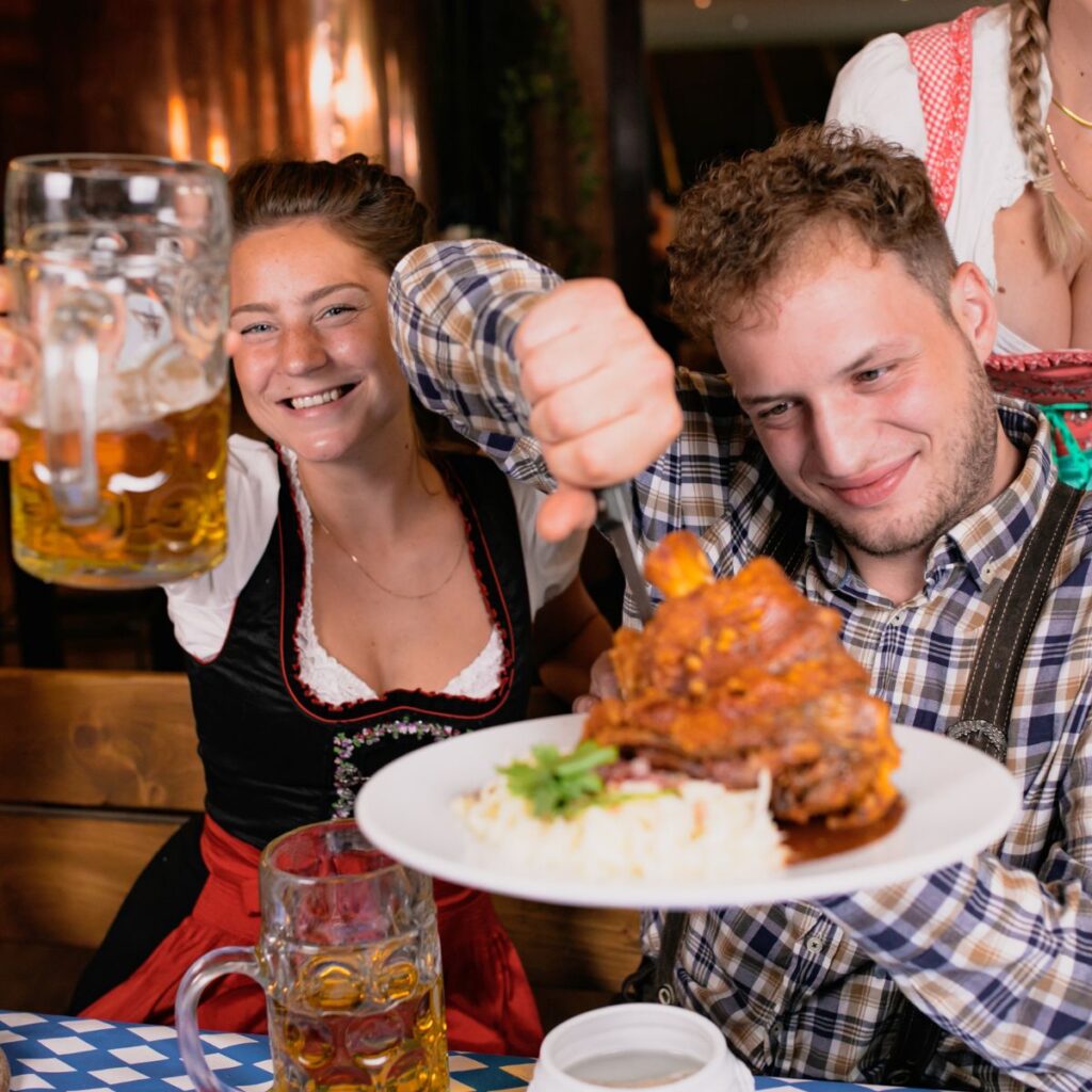Man enjoying plate of Oktoberfest Food