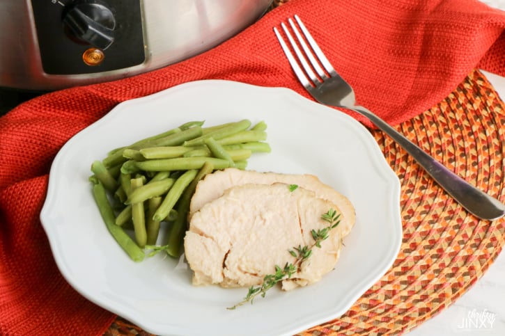 Slow Cooker Turkey Breast On Plate with Green Beans and Garnish