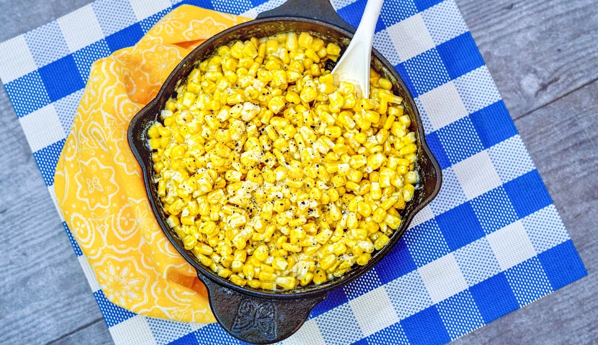 Skillet Creamed Corn with Spoon