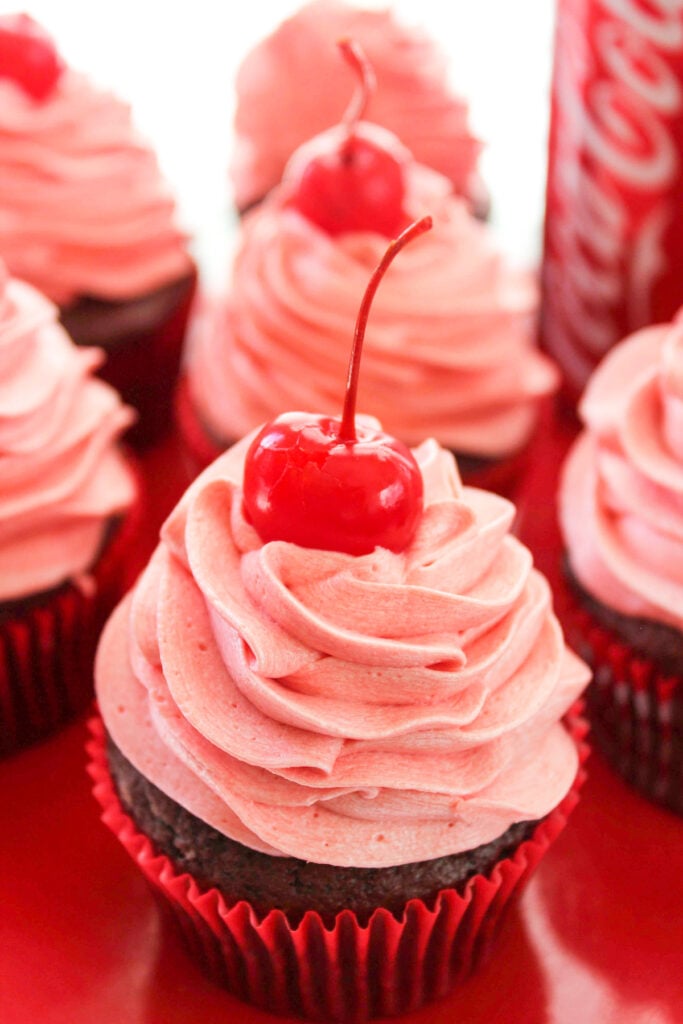 Cherry Coke Cupcakes next to a can of Coke