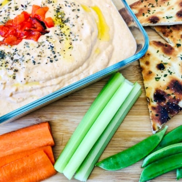 Roasted Red Pepper Hummus with pita wedges and raw vegetables