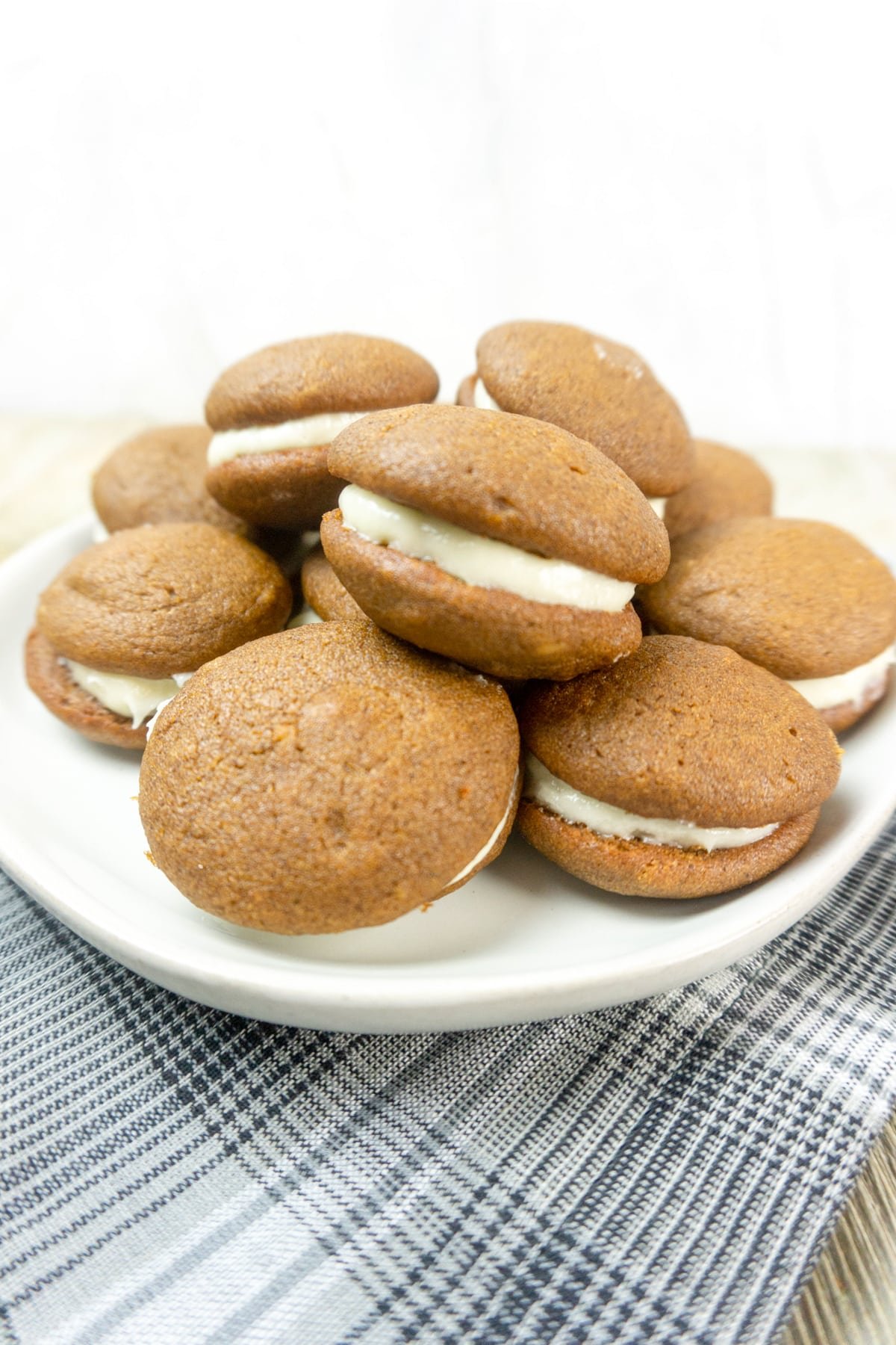 Pumpkin Whoopie Pies Filled with Maple Cream Cheese Frosting.