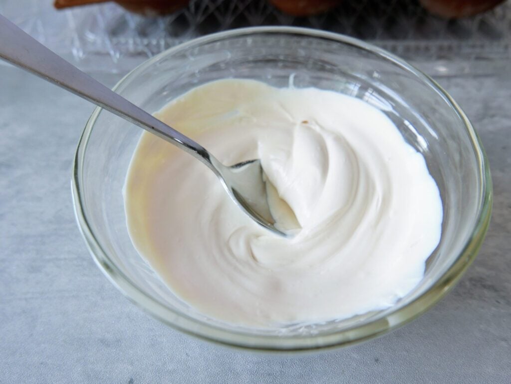 melted white chocolate melts in bowl with spoon