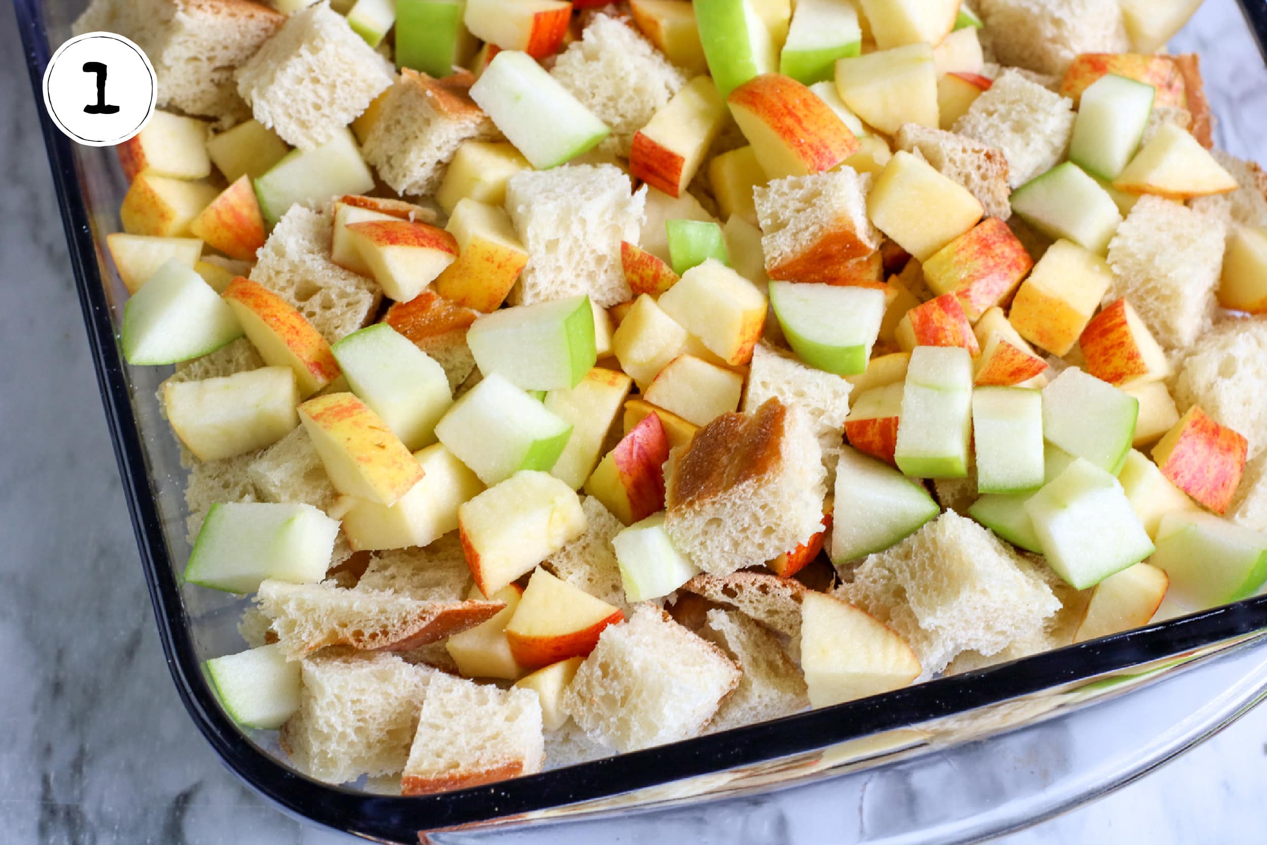 Diced Apples and Cubed Challah Bread in Casserole Dish.