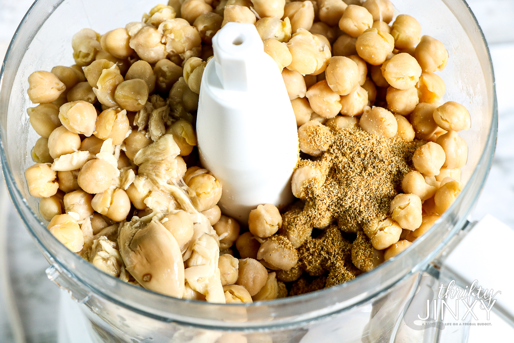 chickpeas in food processor with spices.