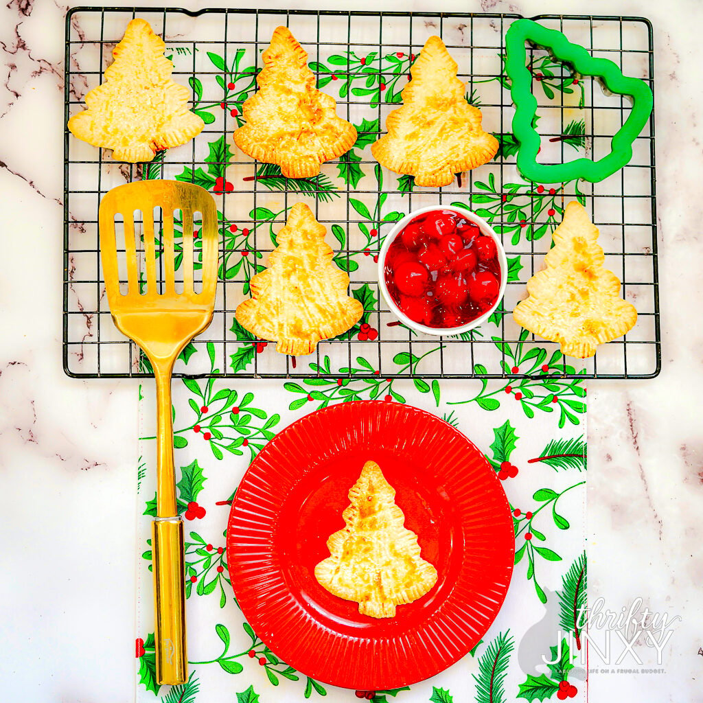 Air Fryer Christmas Tree Hand Pies with Cherry Filling on Cooling Rack