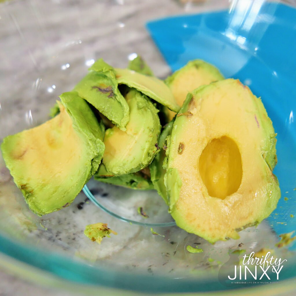 mashing avocado in a bowl