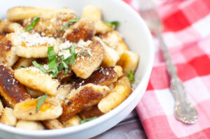 bowl of gnocchi topped with garnish