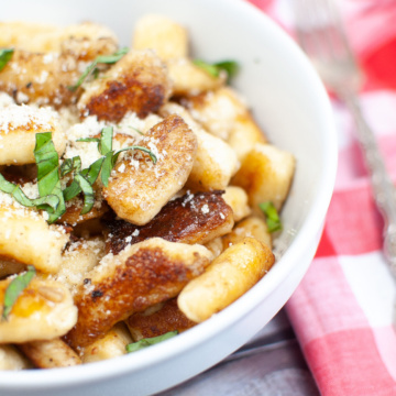 bowl of gnocchi topped with garnish