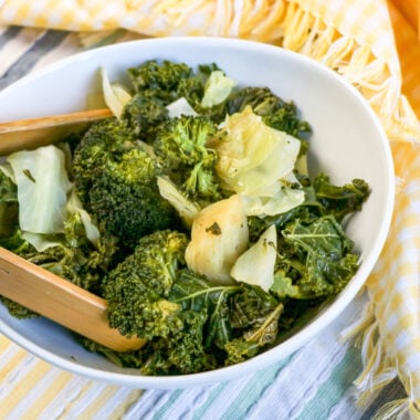 Panda Express Copycat Super Greens in bowl with wooden tongs for serving