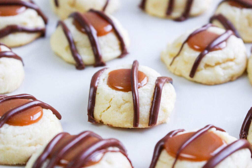 close up of twix cookies drizzled with chocolate 