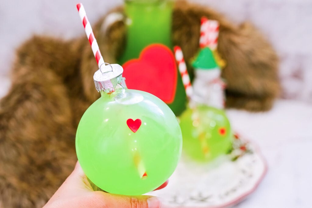 Grinch Punch in ornament with straw