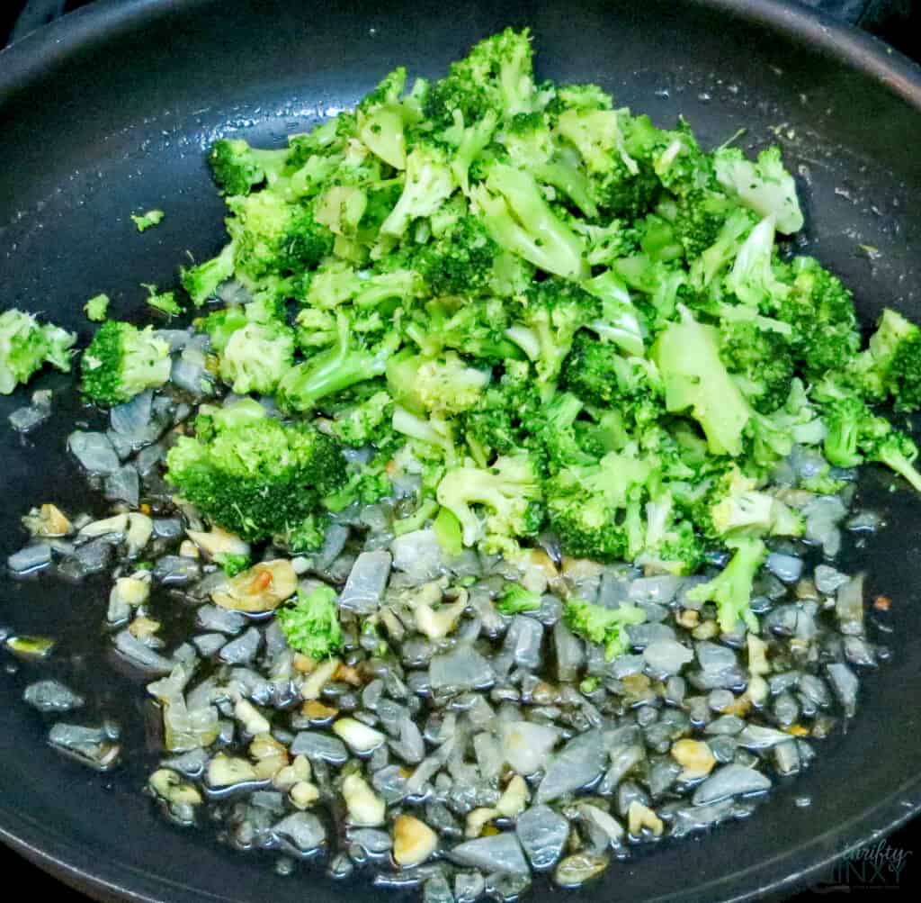 Sauteing broccoli with onions and garlic in olive oil