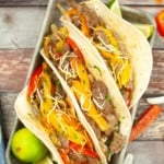 Sheet Pan Steak Fajitas in flour tortillas.