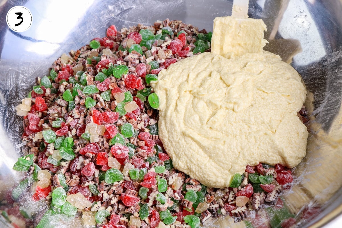 Add cream mixture to candied fruit and nuts.