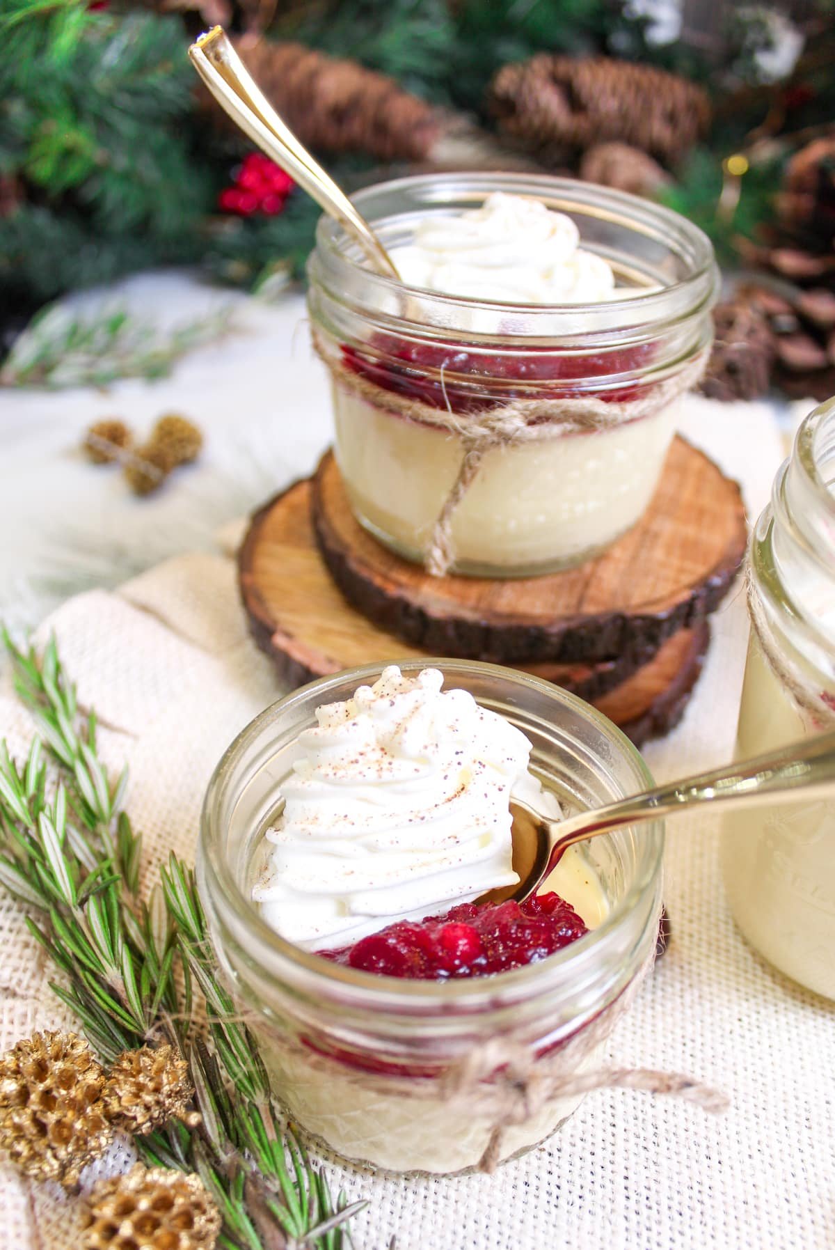 eggnog panna cotta with cranberries and whipped cream.