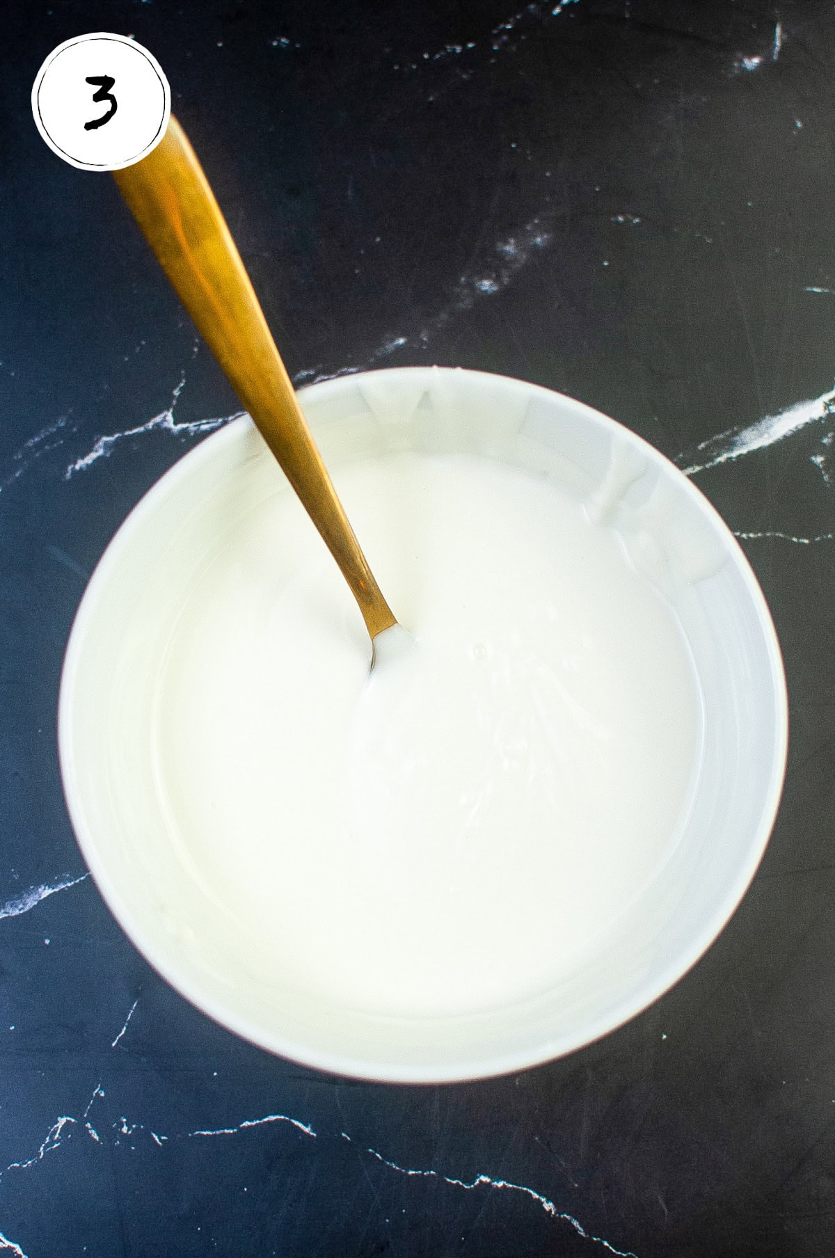 Melted White Almond Bark in Pan.