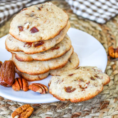 pecan date spice cookies on a white plate