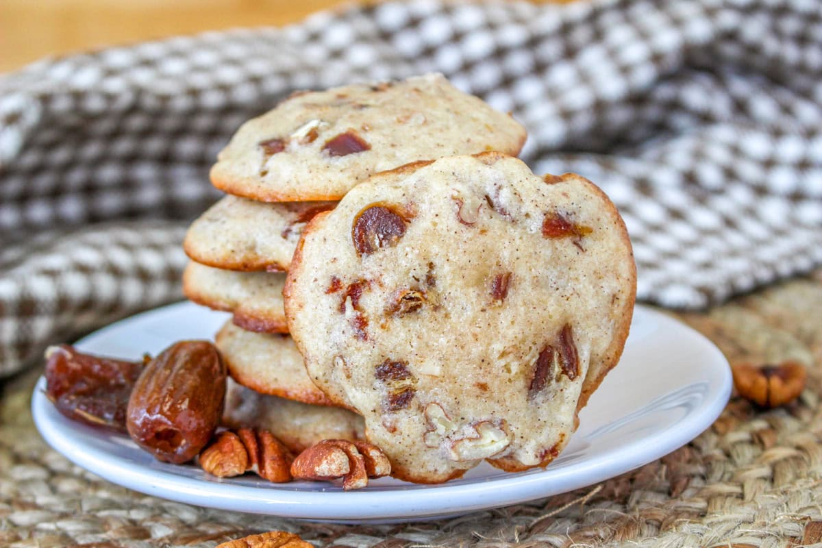 Pecan date spice cookies on a white plate