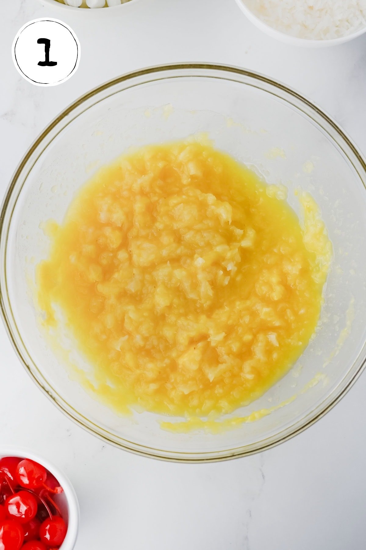 Crushed Pineapple with Vanilla Pudding Mix in glass bowl.