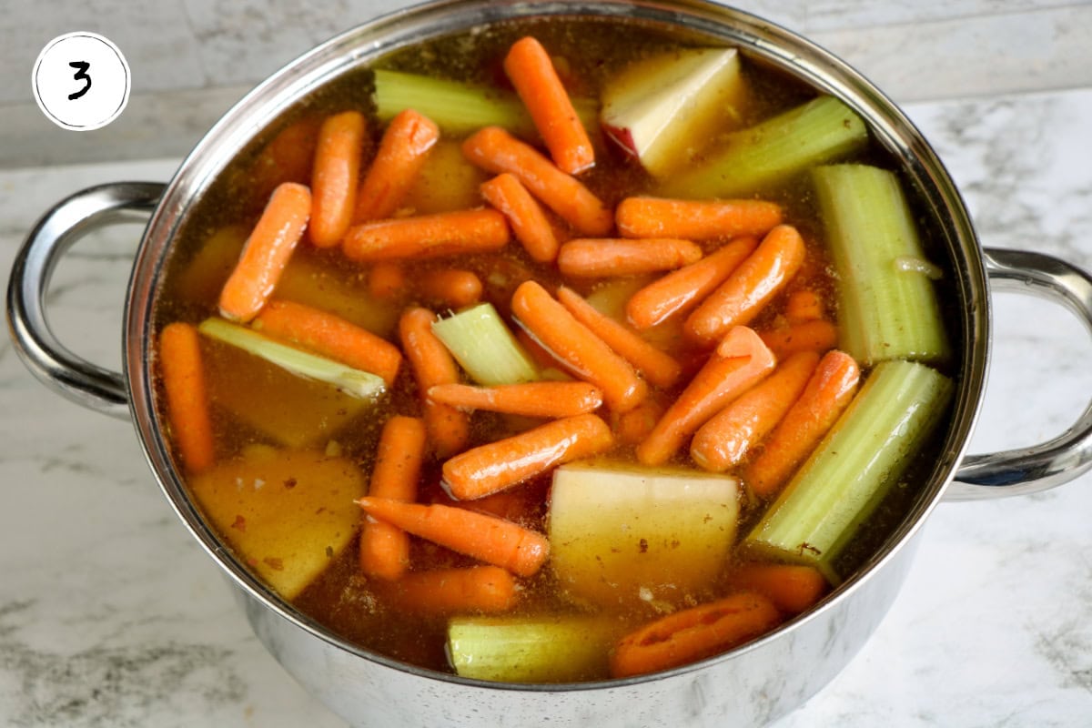 Adding vegetables to Stovetop Pot Roast.